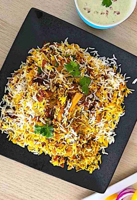 Authentic chicken biryani served in a platter.