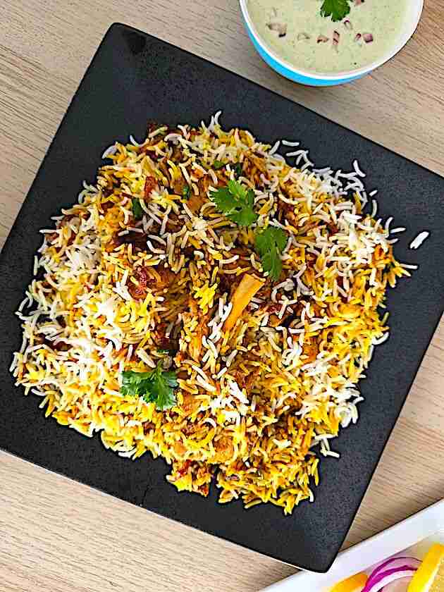 Authentic chicken biryani served in a platter.