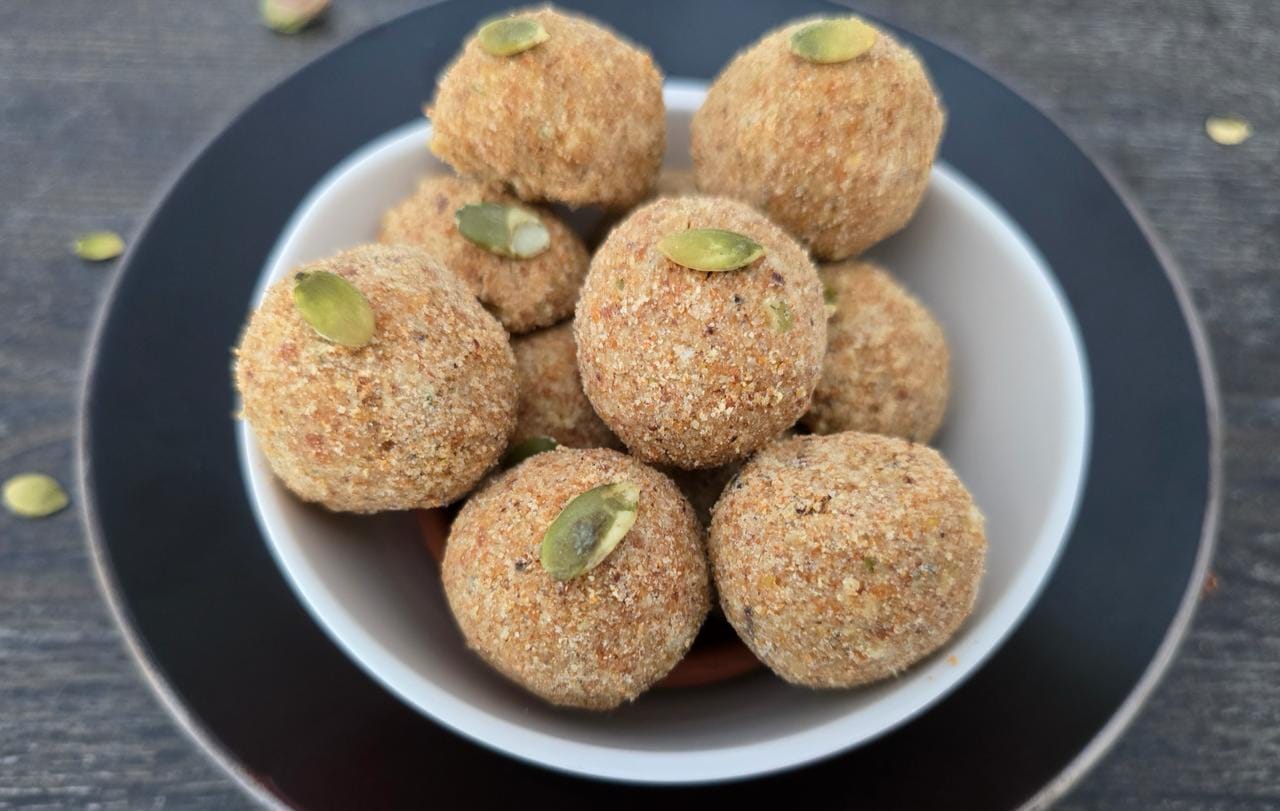 Healthy Laddoo – Nutritious Indian sweet made with jaggery, nuts, and seeds, served on a plate.