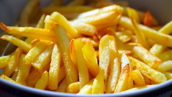 Freshly fired French fries in a bowl